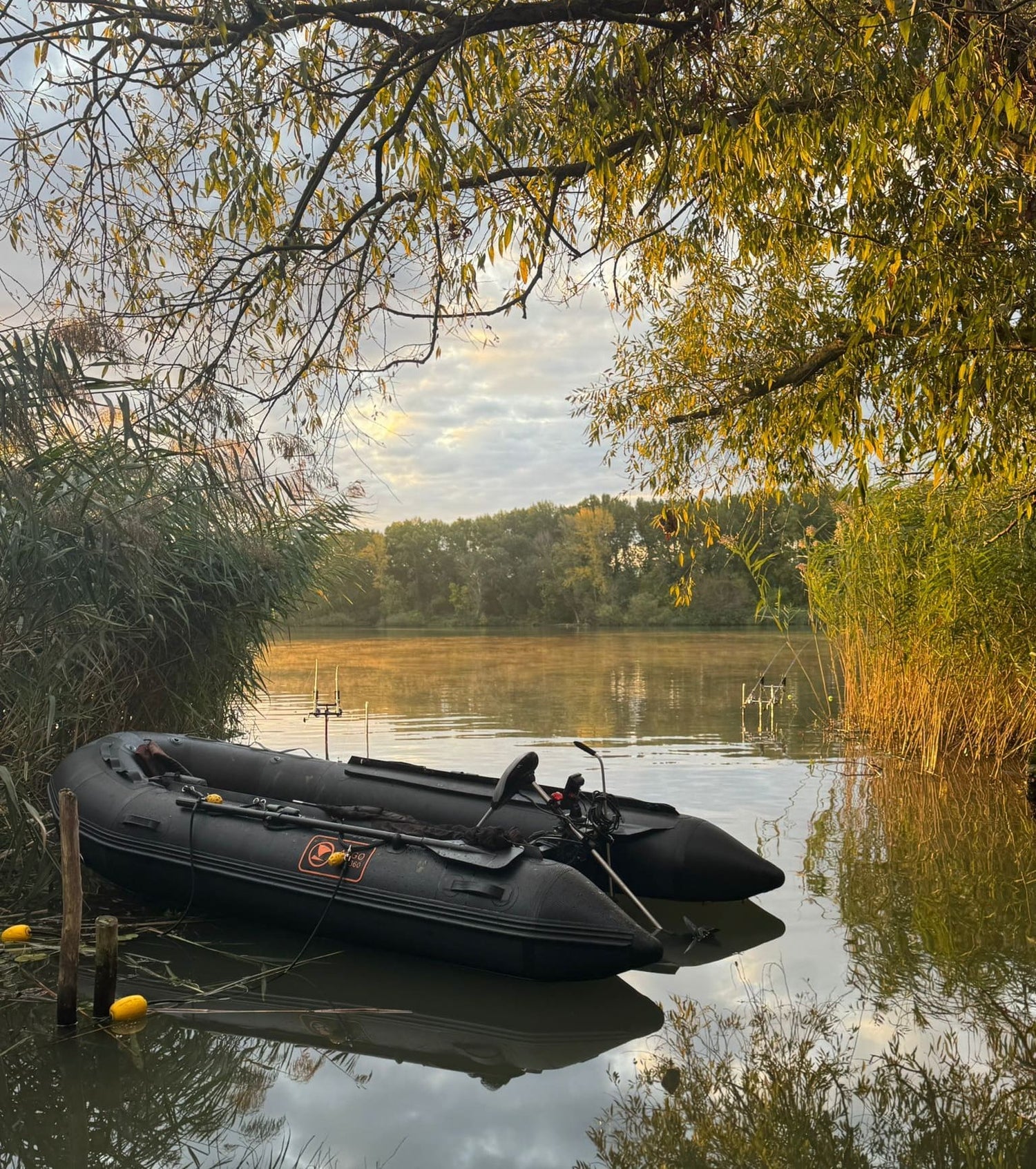 Argo-Evo 330 inflatable boat moored on a calm lake at sunset